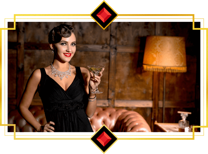 A woman in black dress drinking a cocktail in a moody lounge