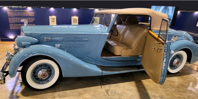 A blue 1936 Packard Twelve Model 1407 in the Art Deco: The Machine Age in Motion