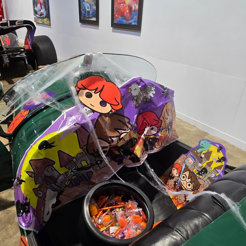 A car at the museum decorated with Harry Potter Halloween decor and buckets of candy
