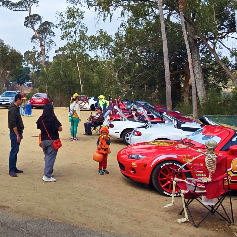 Guests enjoying Trunk or Treat in the Museum parking lot